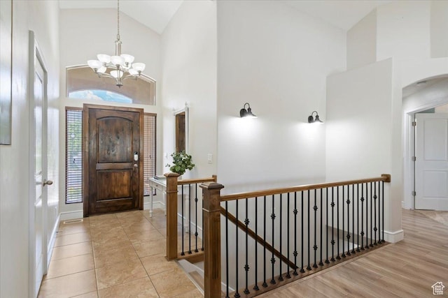 14257 S Round Rock Dr W, Herriman, UT 84096 - foyer with high vaulted ceiling, a chandelier, and arched walkways