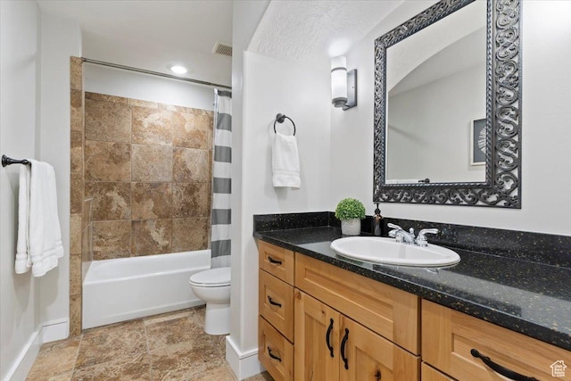 14257 S Round Rock Dr W, Herriman, UT 84096 - full bath featuring vanity, shower / bath combo with shower curtain, and stone finish flooring