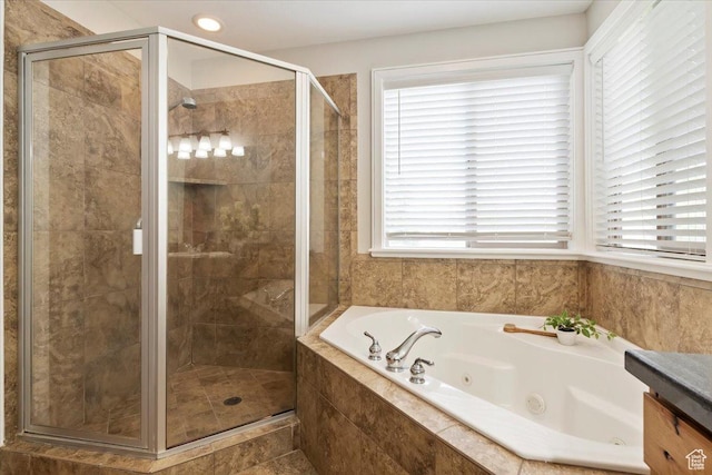14257 S Round Rock Dr W, Herriman, UT 84096 - bathroom with a tub with jets, healthy amount of natural light, a shower stall, and vanity