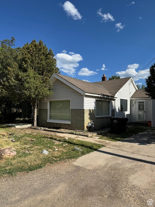 240 E 300 S, Kamas, UT 84036 - view of front of home featuring brick siding and a chimney