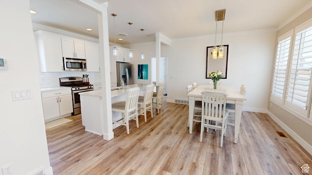 10612 S Lake Ave, South Jordan, UT 84009 - dining room with light wood finished floors, recessed lighting, and a chandelier