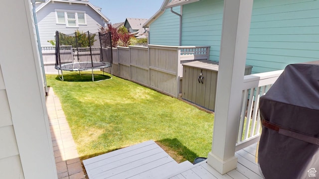 10612 S Lake Ave, South Jordan, UT 84009 - view of yard featuring a trampoline and a wooden deck