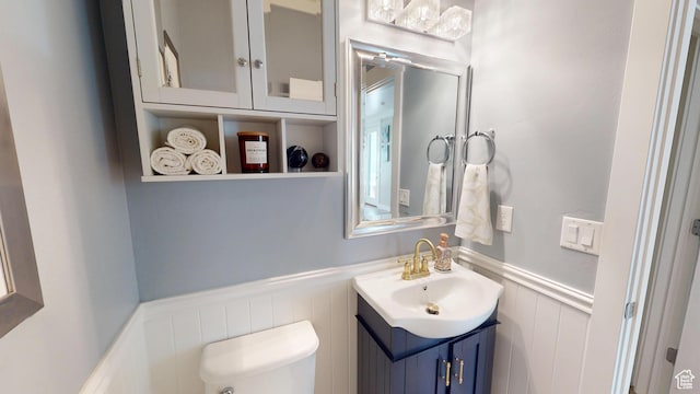 10612 S Lake Ave, South Jordan, UT 84009 - half bath featuring wainscoting, vanity, and a decorative wall