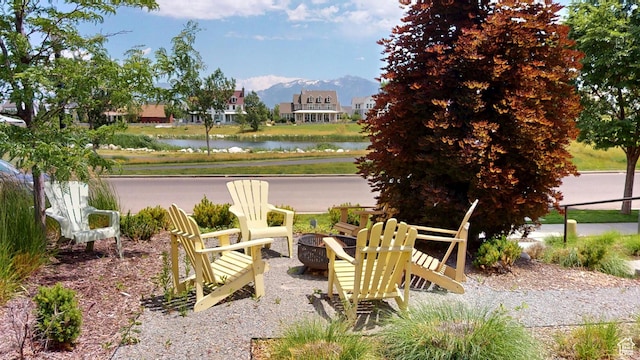 10612 S Lake Ave, South Jordan, UT 84009 - view of patio featuring a water and mountain view and an outdoor fire pit