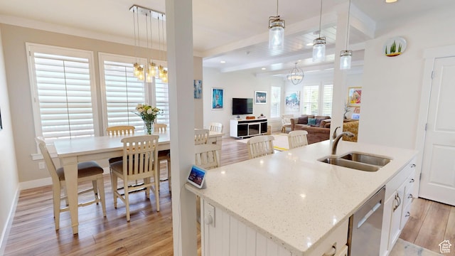 10612 S Lake Ave, South Jordan, UT 84009 - kitchen featuring stainless steel dishwasher, light wood-style flooring, beam ceiling, a chandelier, and a center island with sink