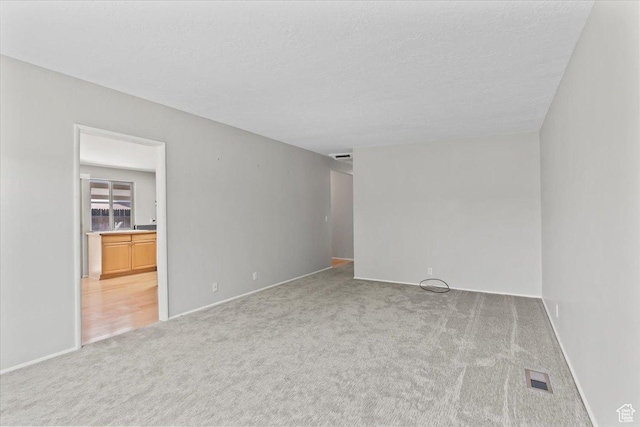 3705 W 3800 S, West Valley City, UT 84120 - carpeted empty room featuring baseboards