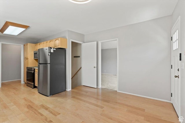3705 W 3800 S, West Valley City, UT 84120 - kitchen with appliances with stainless steel finishes, light brown cabinetry, and light wood-style floors
