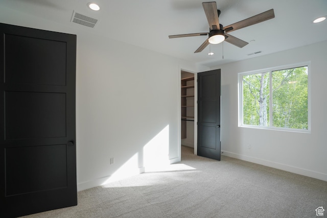 11234 E Columbine Ln, Heber City, UT 84032 - unfurnished bedroom with light colored carpet, recessed lighting, a spacious closet, and ceiling fan