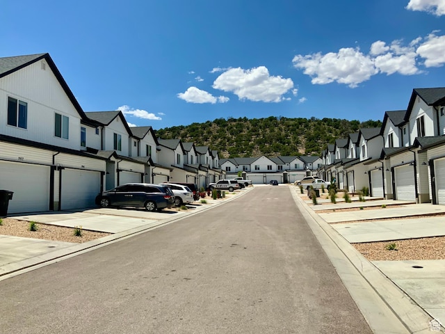 2953 W Ezra Dr, Cedar City, UT 84720 - view of asphalt road with a residential view and curbs