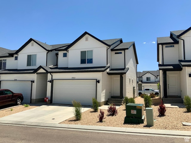 2953 W Ezra Dr, Cedar City, UT 84720 - view of front of home with an attached garage, entry steps, and driveway