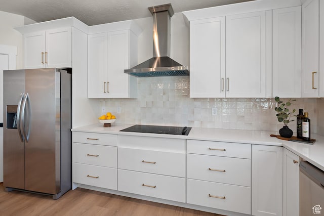 1324 E 320 S, Payson, UT 84651 - kitchen featuring appliances with stainless steel finishes, wall chimney range hood, light wood finished floors, white cabinetry, and light countertops