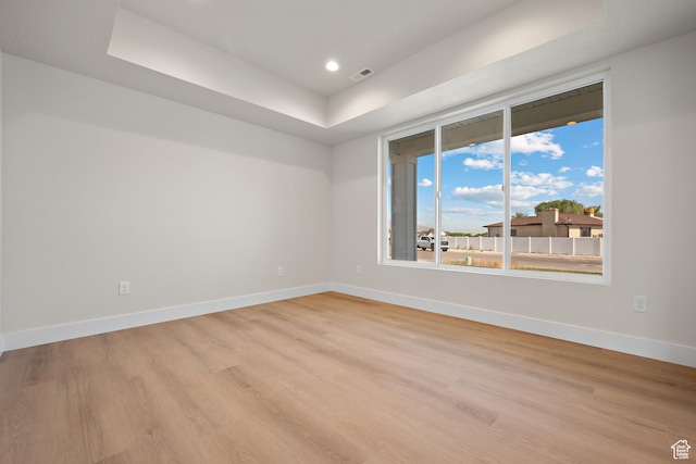 1324 E 320 S, Payson, UT 84651 - unfurnished room with light wood-style floors, a raised ceiling, and recessed lighting