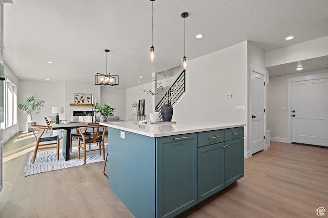 1324 E 320 S, Payson, UT 84651 - kitchen featuring light wood-style flooring, recessed lighting, decorative light fixtures, light countertops, and a center island