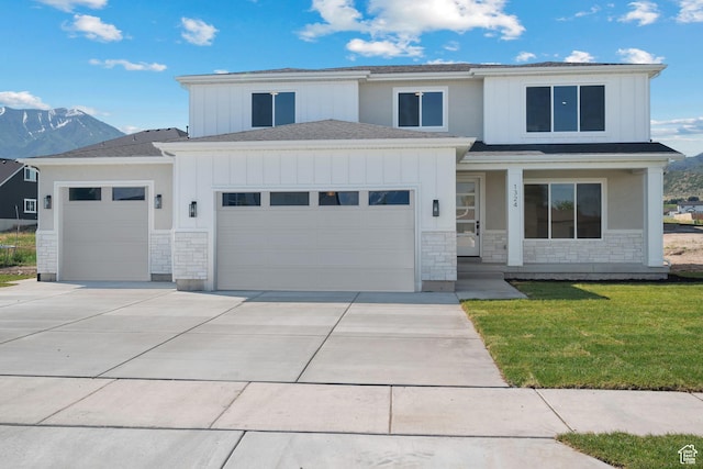 1324 E 320 S, Payson, UT 84651 - view of front of home featuring an attached garage, stone siding, driveway, and board and batten siding
