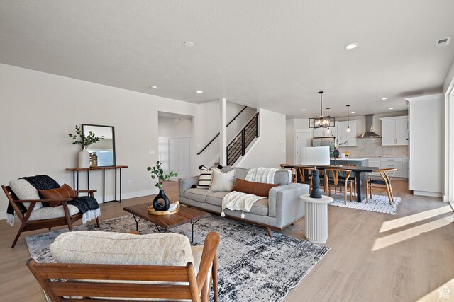 1324 E 320 S, Payson, UT 84651 - living area with light wood-style floors, recessed lighting, stairway, and a chandelier