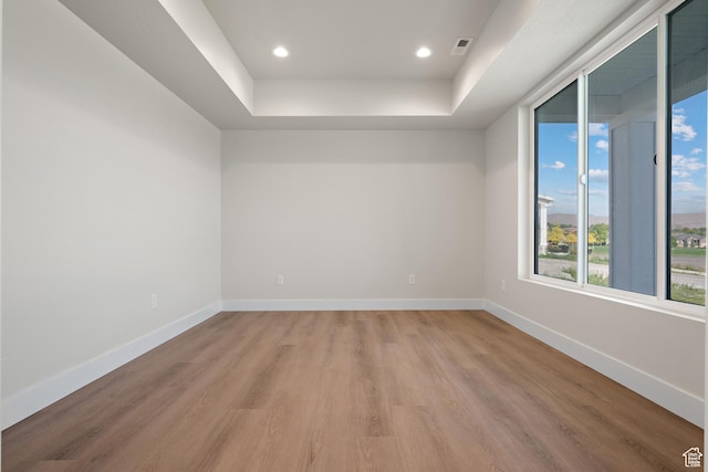 1324 E 320 S, Payson, UT 84651 - empty room featuring light wood-style floors, a raised ceiling, and recessed lighting