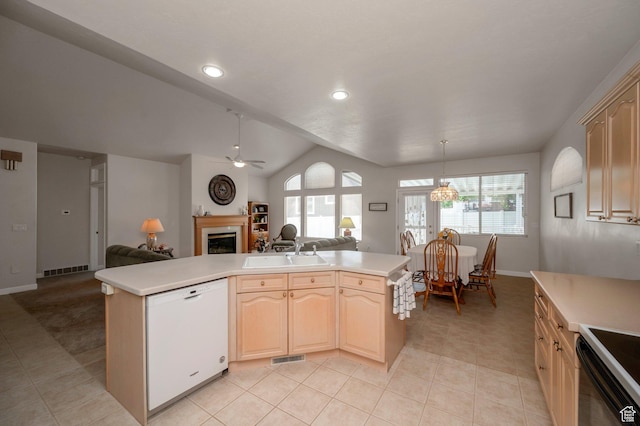 10056 S Remembrance Ln, South Jordan, UT 84095 - kitchen featuring white dishwasher, open floor plan, a fireplace, light countertops, and lofted ceiling