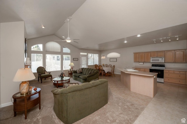 10056 S Remembrance Ln, South Jordan, UT 84095 - living area with vaulted ceiling, light tile patterned flooring, ceiling fan, healthy amount of natural light, and recessed lighting