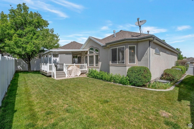 10056 S Remembrance Ln, South Jordan, UT 84095 - back of property featuring stucco siding, a fenced backyard, and a shingled roof