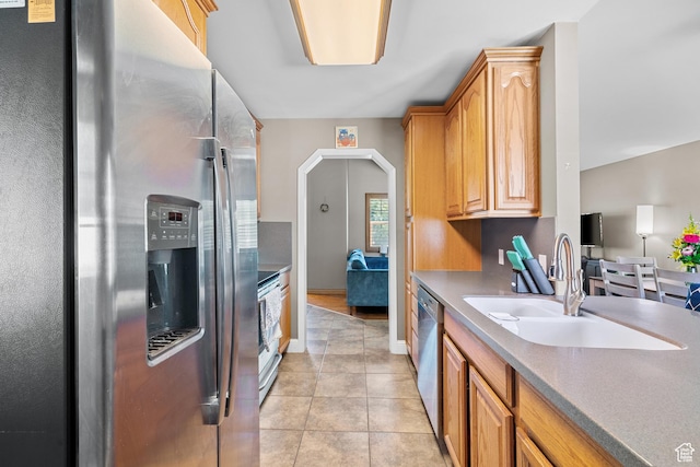 790 E 5300 S, South Ogden, UT 84405 - kitchen featuring stainless steel appliances, light tile patterned floors, and arched walkways