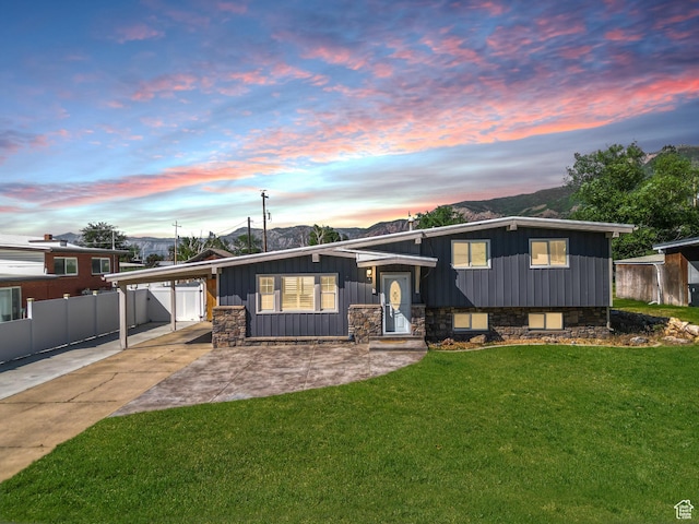 790 E 5300 S, South Ogden, UT 84405 - tri-level home with board and batten siding, an attached carport, concrete driveway, a mountain view, and stone siding
