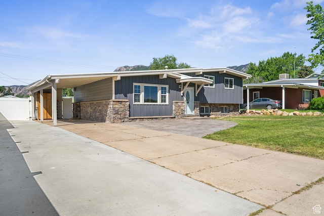 790 E 5300 S, South Ogden, UT 84405 - view of front of property featuring concrete driveway, stone siding, and an attached carport