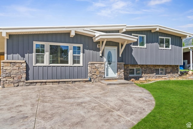 790 E 5300 S, South Ogden, UT 84405 - view of front of property featuring a front lawn, board and batten siding, and a patio