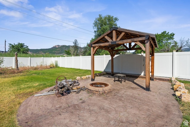 790 E 5300 S, South Ogden, UT 84405 - fenced backyard with an outdoor fire pit, a gazebo, a patio, and a mountain view