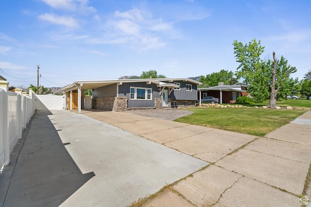 790 E 5300 S, South Ogden, UT 84405 - view of front facade with driveway, stone siding, and a carport