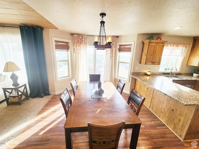 1365 N Highland Blvd, Brigham City, UT 84302 - dining area featuring a textured ceiling, dark wood-style flooring, and a chandelier