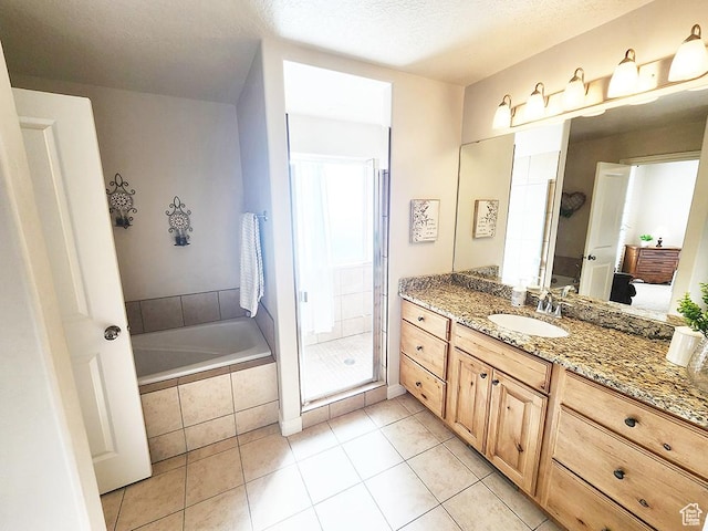 1365 N Highland Blvd, Brigham City, UT 84302 - bathroom with vanity, a bath, a stall shower, and tile patterned flooring