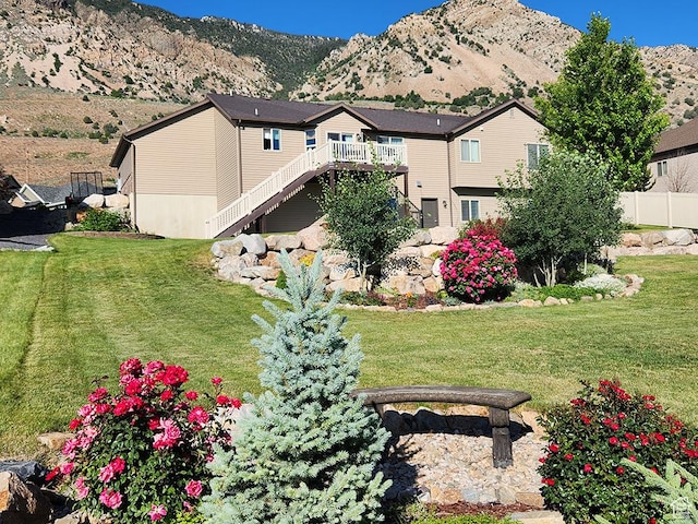 1365 N Highland Blvd, Brigham City, UT 84302 - back of property with a deck with mountain view and stairway