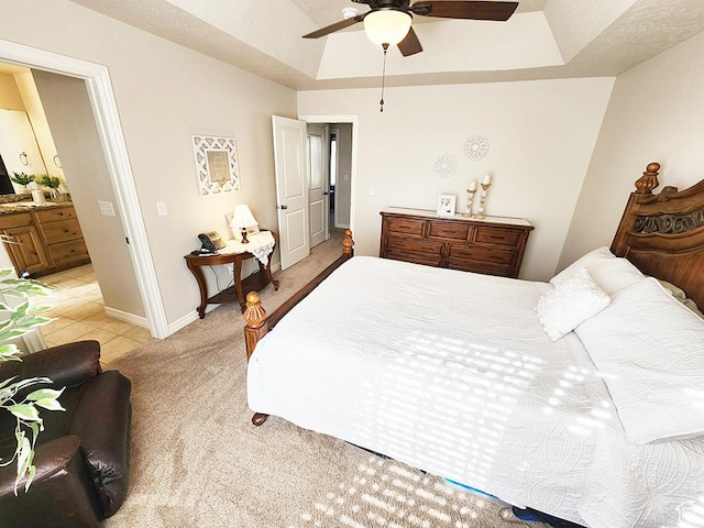 1365 N Highland Blvd, Brigham City, UT 84302 - bedroom with a tray ceiling, light colored carpet, connected bathroom, and a ceiling fan
