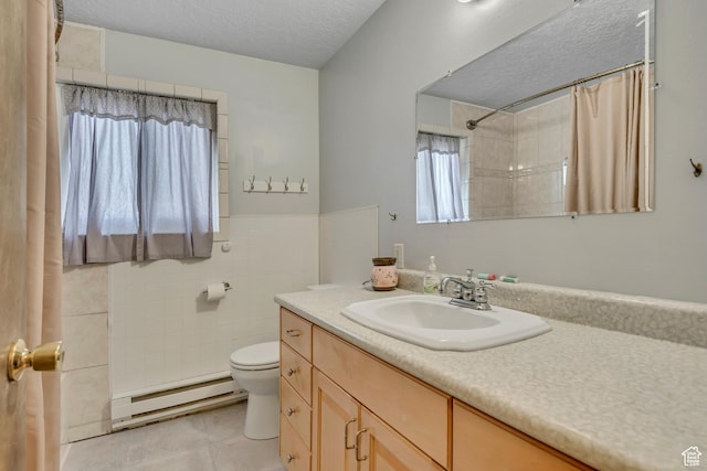 501 N Main St, Vernon, UT 84080 - full bathroom featuring a baseboard radiator, vanity, a textured ceiling, a shower with curtain, and tile walls