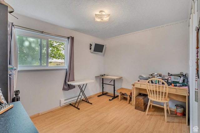 501 N Main St, Vernon, UT 84080 - miscellaneous room featuring wood finished floors, a textured ceiling, and a baseboard radiator