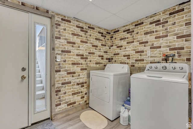 501 N Main St, Vernon, UT 84080 - laundry area featuring washer and dryer, brick wall, and light wood-style floors