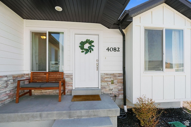 4082 N Poplar Dr, Eagle Mountain, UT 84005 - property entrance with board and batten siding, stone siding, and covered porch