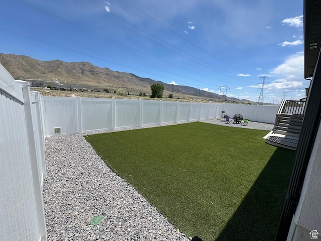 4082 N Poplar Dr, Eagle Mountain, UT 84005 - fenced backyard featuring a mountain view and a patio