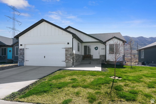 4082 N Poplar Dr, Eagle Mountain, UT 84005 - view of front facade featuring entry steps, board and batten siding, stone siding, and a front lawn