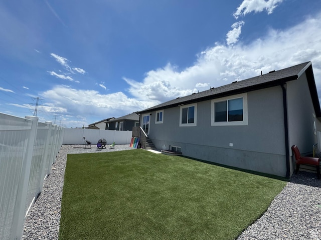 4082 N Poplar Dr, Eagle Mountain, UT 84005 - rear view of house with a fenced backyard and a patio