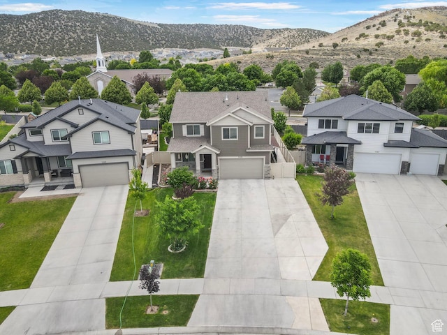 7335 N Harvest Crop Dr, Eagle Mountain, UT 84005 - aerial perspective of suburban area featuring a mountainous background