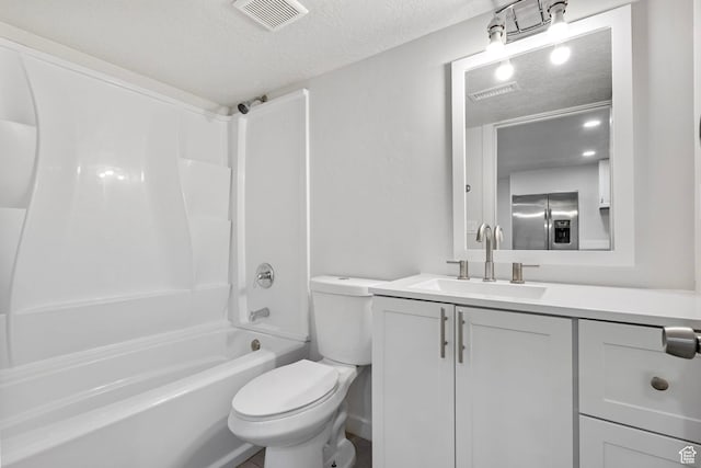 7335 N Harvest Crop Dr, Eagle Mountain, UT 84005 - bathroom featuring a textured ceiling, vanity, and shower / bathtub combination