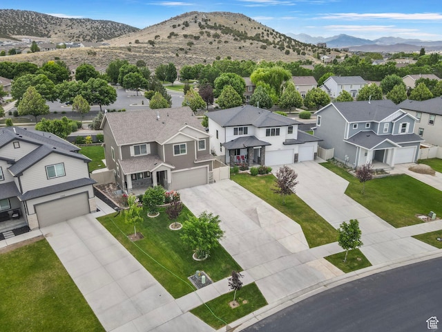 7335 N Harvest Crop Dr, Eagle Mountain, UT 84005 - aerial view of residential area featuring a mountainous background