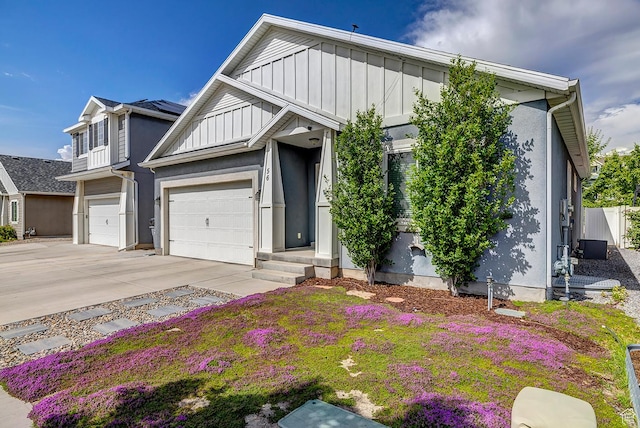 56 N Rue De Matth W, Vineyard, UT 84058 - view of front of house with concrete driveway, board and batten siding, and stucco siding
