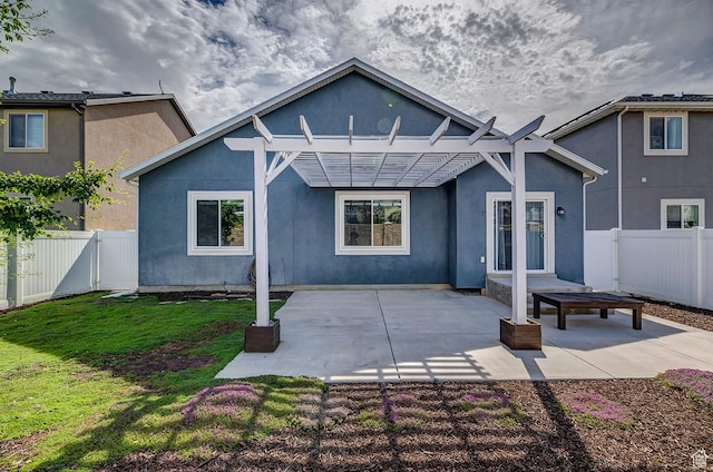 56 N Rue De Matth W, Vineyard, UT 84058 - back of property featuring a pergola, a fenced backyard, stucco siding, and a patio