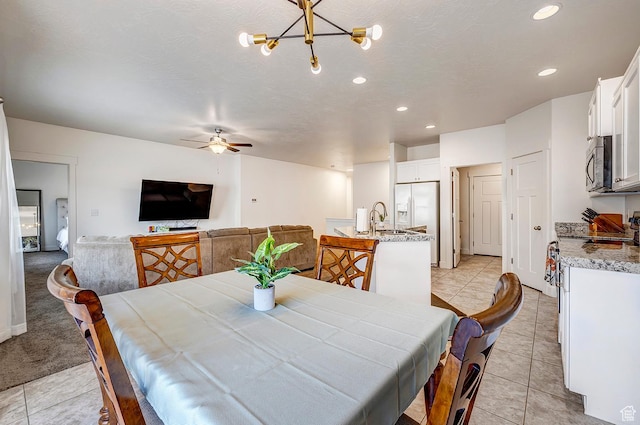 56 N Rue De Matth W, Vineyard, UT 84058 - dining space with a ceiling fan, recessed lighting, light tile patterned floors, and a chandelier