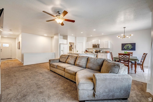 56 N Rue De Matth W, Vineyard, UT 84058 - living room featuring light carpet, a chandelier, ceiling fan, recessed lighting, and a textured ceiling