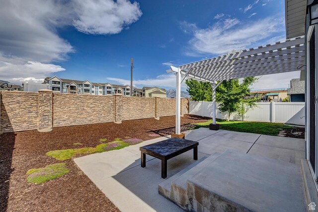 56 N Rue De Matth W, Vineyard, UT 84058 - fenced backyard featuring a pergola, a patio area, and a residential view