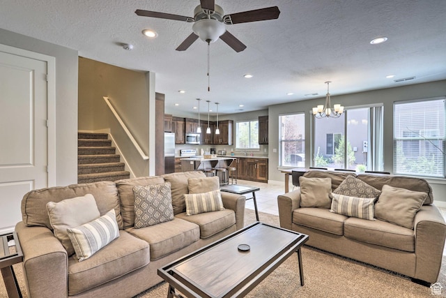 615 W 470 N, Moab, UT 84532 - living room with a chandelier, recessed lighting, stairway, a ceiling fan, and a textured ceiling