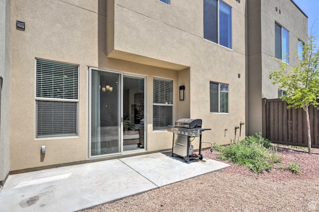 615 W 470 N, Moab, UT 84532 - rear view of house with a patio and stucco siding
